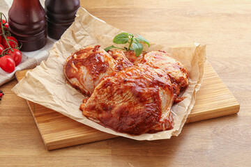 Marinated chicken leg in tomato sauce