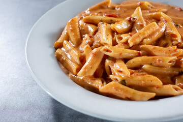 A view of a plate of penne Arrabbiata.