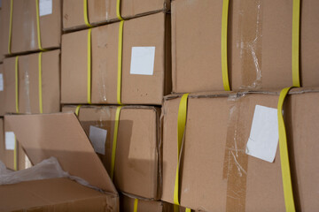 A view of several stacks of full cardboard boxes.