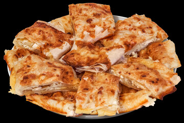 Freshly Baked Cheese Roll Pie Slices Served on Round Ceramic Tray Isolated on Black Background
