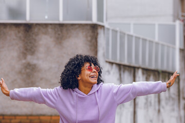 girl in the street outdoors with expression of happiness and joy