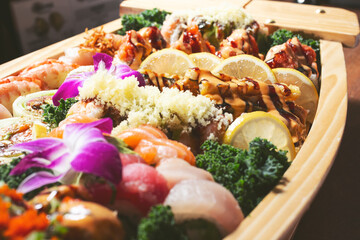 A closeup view of a sushi boat, featuring a variety of sushi pieces. © DAVID