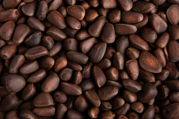 Pine nuts in a shell, pine nuts background. Healthy snacks.