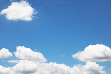Obraz na płótnie Canvas Blue sky background and white clouds soft focus, and copy space horizontal shape.