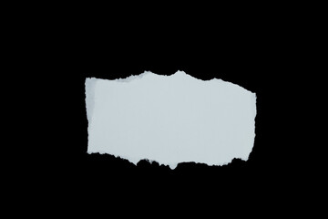 Blank torn paper isolated on black background. Top view of white paper piece with copy space.