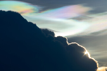 Beautiful iridescent cloud, Irisation. Skyscraper background.