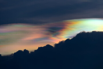 Beautiful iridescent cloud, Irisation. Skyscraper background.