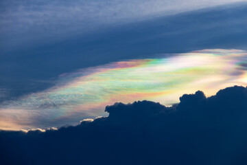 Beautiful iridescent cloud, Irisation. Skyscraper background.