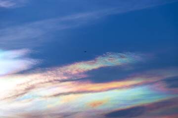 Beautiful iridescent cloud, Irisation. Skyscraper background.