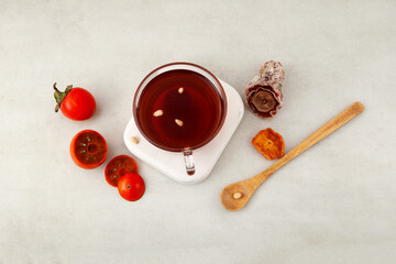 Sujeonggwa tea, top view. Traditional Korean drink. Fruit punch of dried persimmons with the addition of cinnamon, ginger and pine nuts