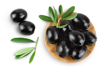 Black olives with leaves in wooden bowl isolated on a white background with full depth of field. Top view. Flat lay