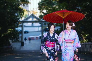 Two japanese girls wearing kimonos traditional clothes, lifestyle moments