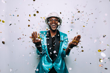 portrait of an hip hop music performer with confetti drop