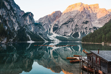 Stunning view of the Lake Braies (Lago di Braies) with some wooden boats and beautiful mountains...