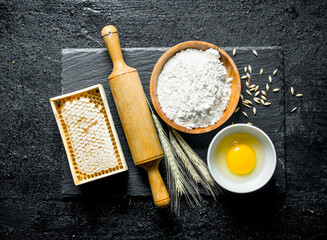 Fototapeta premium Flour, honey, egg and spikelets.