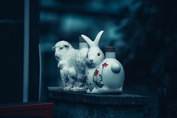white rabbit statue with black background in Japan