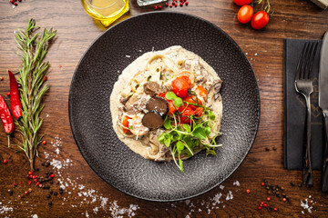 Black Angus beef tagliatelle pasta with fresh black truffles and parmegano. Delicious healthy traditional food closeup served for lunch in modern gourmet cuisine restaurant - 562171076