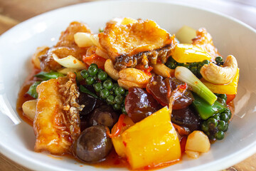 Deep fried snapper(sea bass) fillets stir fried with cashew nut, Jujube, Chestnuts, Ginkgo and Sweet pepper.