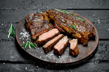 Grilled beef steaks on a cutting Board.