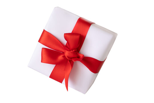 White vector giftbox. Realistic gift box, with the red satin bow, isolated on background. Cube shape present box, tied with red wrapping ribbon, standing on a surface in a front view.