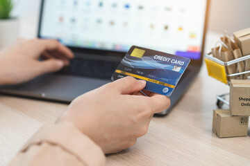 internet shopping e commerce concept, woman using credit card shopping on internet.