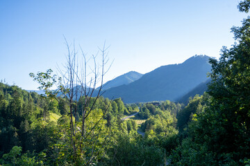 Panoramic view of beautiful mountain landscape, green Austrian village in the Alps, Mountains surrounding the Austrian village