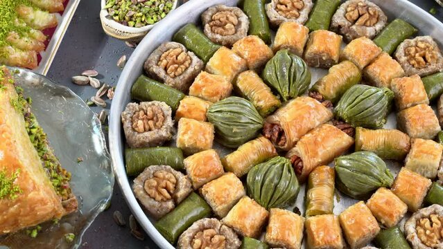 Traditional turkish baklava pistachio pastry. Dilberdudagi, ozel kesim baklava, cikolatali baklava, fistikli baklava, katmer, fistikli kadayif, kattafi, fistik sarma, soguk baklava, midye baklava, cev