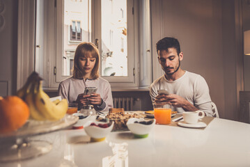 Fototapeta na wymiar couple making breakfast at home. Concept about lifestyle, healthy food and relationship