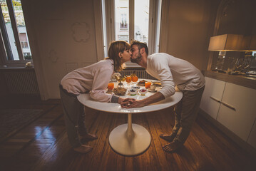 Happy couple making breakfast at home. Concept about lifestyle, healthy food and relationship