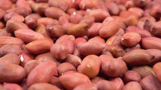many of red peanuts in a table
