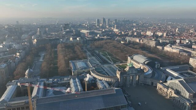 Jubelpark, Park of the Fiftieth Anniversary in Brussels, Belgium. Europe. Urban monumental park, aerial drone overhead city skyline view. Arc de Triomphe, Cinquantenaire park. Winter day.
