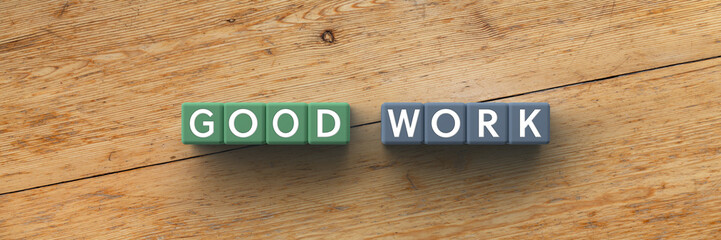 3D Cubes with the words good work on a wooden background	
