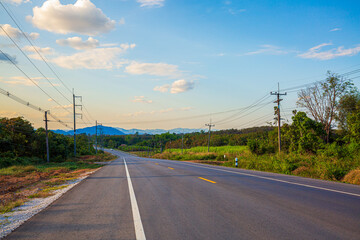 Fototapeta premium Rural road with beautiful mountains in Thailand,sky road over top of mountains with green jungle in Nan province, Thailand