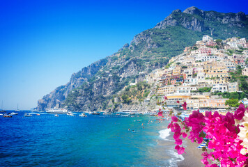 Sea and beach of Positano - famous old italian resort with flowers, Italy