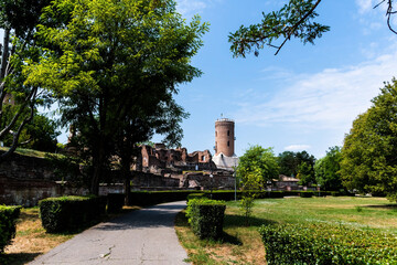Fototapeta na wymiar The Royal Court of Targoviste with the Chindia tower seen from the park, Romania.