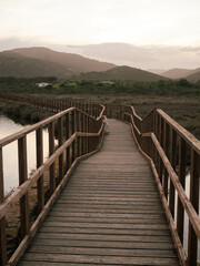 wooden bridge over the lake in Sardinian hills 