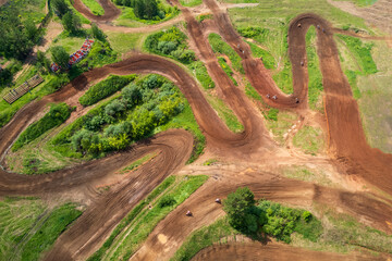 top view of a motocross track, curved road lines made of clay on the ground