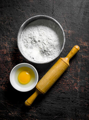 Flour a rolling pin and an egg.