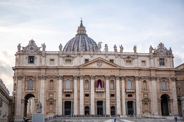 Fototapeta na wymiar Saint Peter's Basilica in Rome from the ellipse of the square in cloudy day