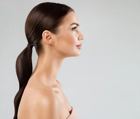 Beauty Model Perfect Face Profile. Brunette Woman with Healthy Smooth Facial Skin and Hair over White. Beautiful Girl Side view Portrait with Full Lips and Natural Make up. Female Plastic Surgery © inarik