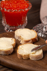 Baguette sandwiches with butter and red caviar