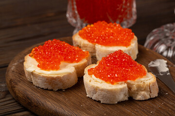 Baguette sandwiches with butter and red caviar