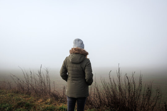 Lost Person In Fog. Lonely Woman In Empty Misty Landscape