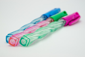 red green and blue pens on white background	