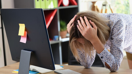 Business woman made mistake in business and is going through in office.