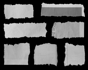 Torn papers on black