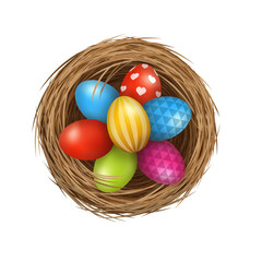 Easter eggs on wild bird nest from straw and twigs