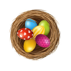 Easter eggs on wild bird nest from straw and twigs