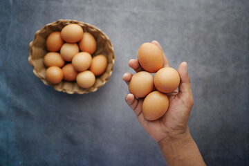 top view of men holding eggs 