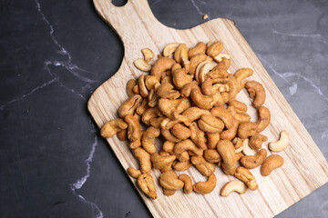 cashew nut on a chopping board on table 